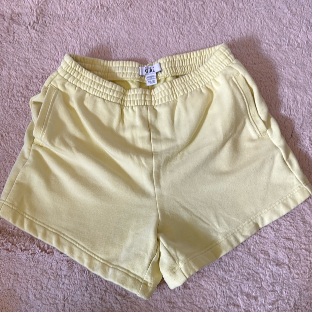 Used - good condition.  Yellow Athleta Girl size XXL/16 shorts